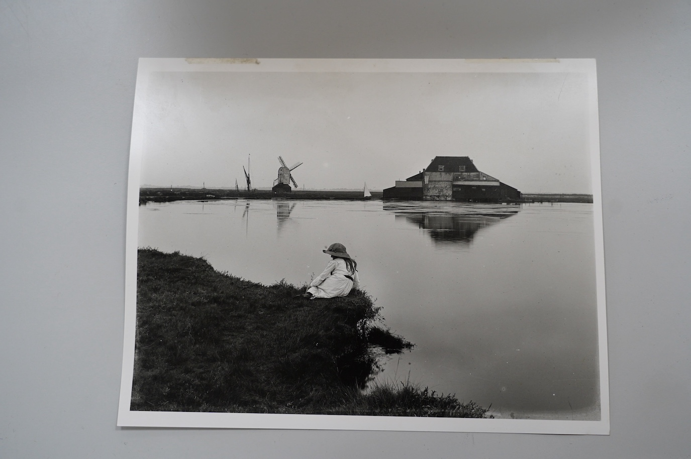 Attributed to Edward King RA (1863-1930), oil on canvas, Study of Tide Mill and Windmill at Walton on the Naze, together with English Heritage National Monuments Record photograph of the scene, oil 44.5 x 90.5cm. Conditi